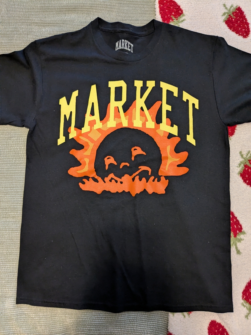 MARKET Black Graphic Tee with Yellow & Orange Smiling Sun Design